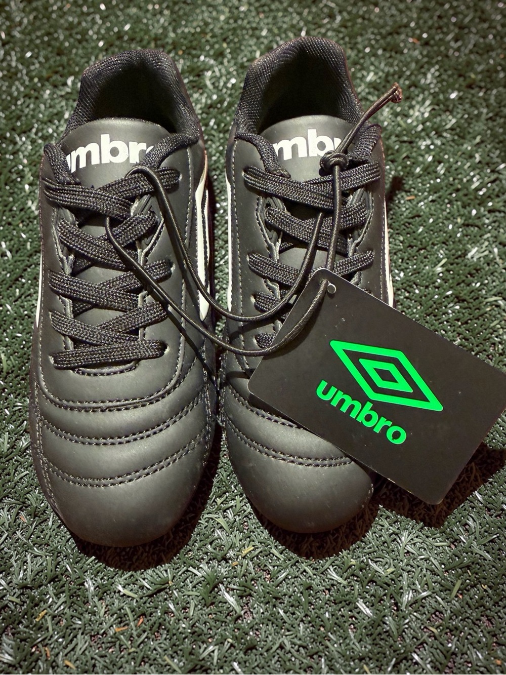 Umbro Men’s Black Athletic Soccer Shoes with Green Logo Tag